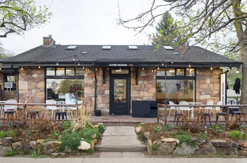 Alpine Modern Cafe University Hill location exterior — a historic stone cottage in Boulder, CO